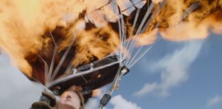 Tom Cruise is awarded the Guinness World Record after 16 fiery skydives during the filming of Mission Impossible